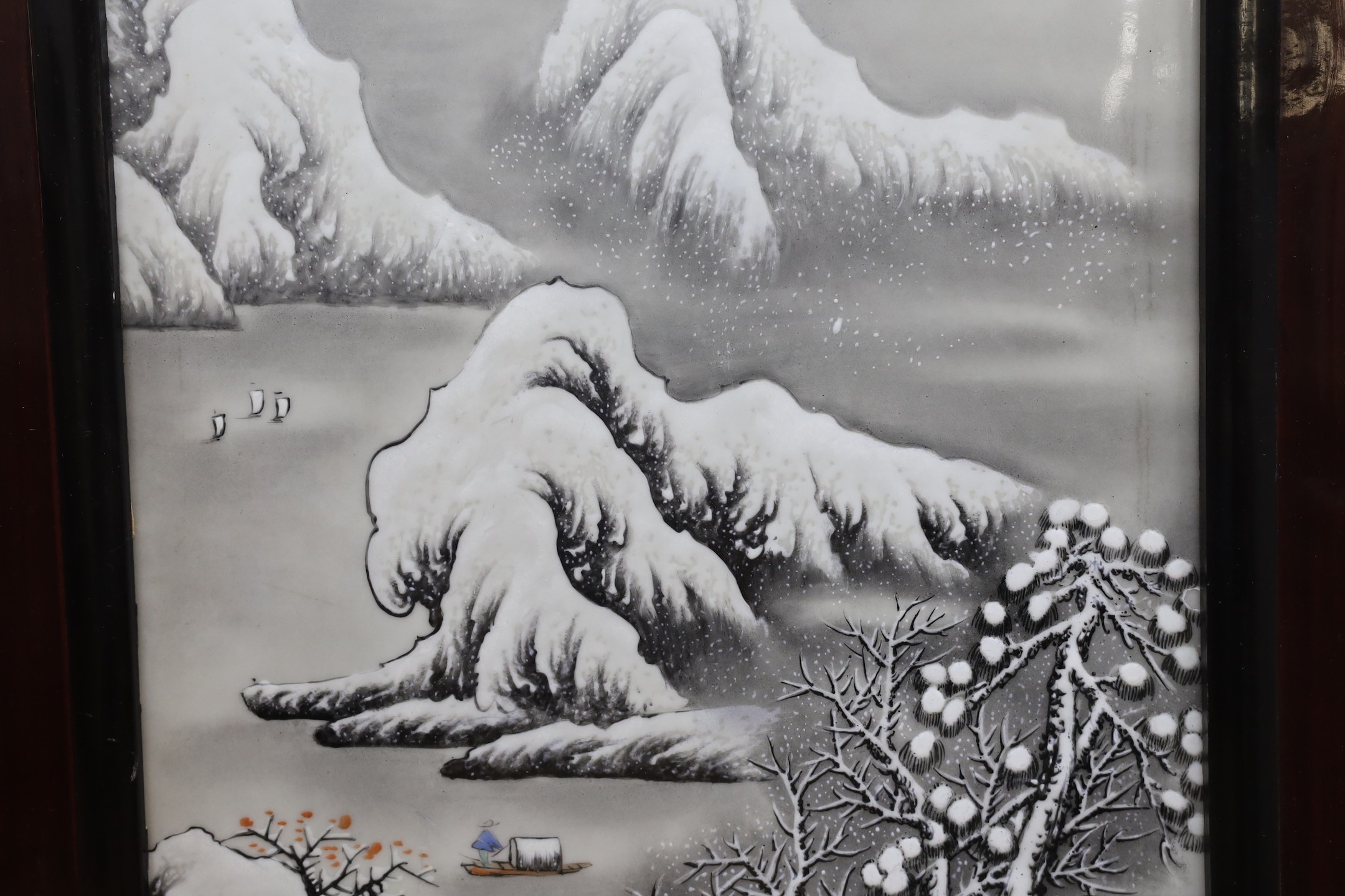 A Chinese framed porcelain plaque decorated with a winter scene, 31 cms wide x 54 cms high (not including frame)